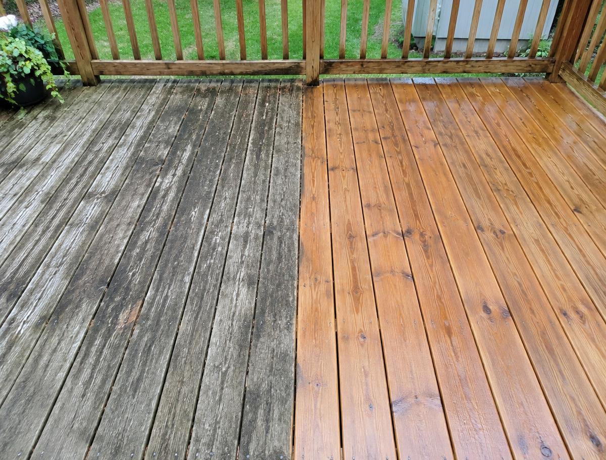 Wood deck, weathered grey half next to washed half